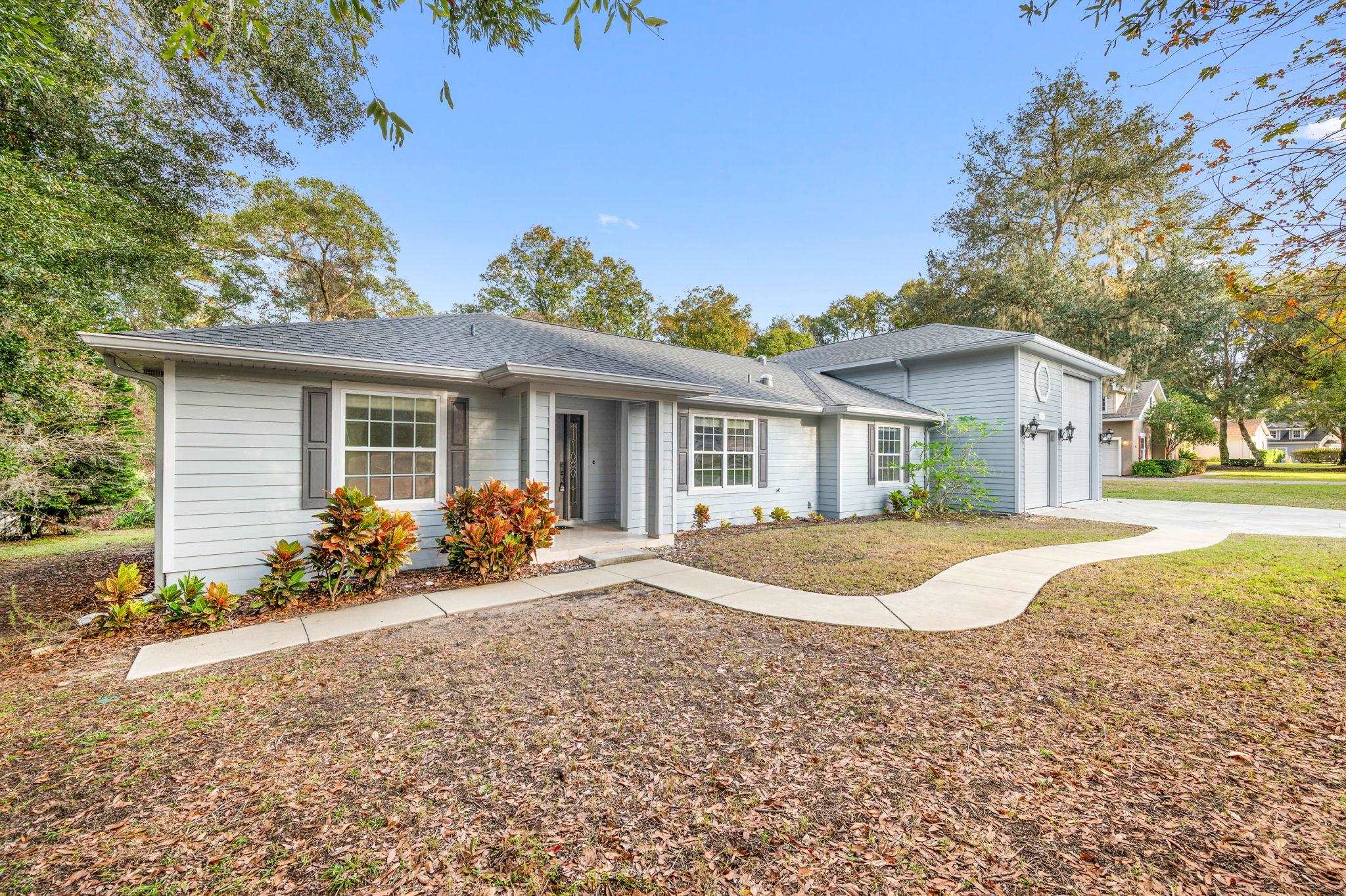 3489 Kings Road St. Augustine, FL 32086 - Photo 4 of 76 a front view of a house with a yard