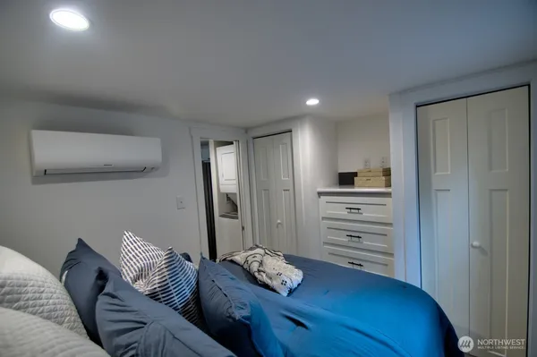 a living room with furniture and a ceiling fan