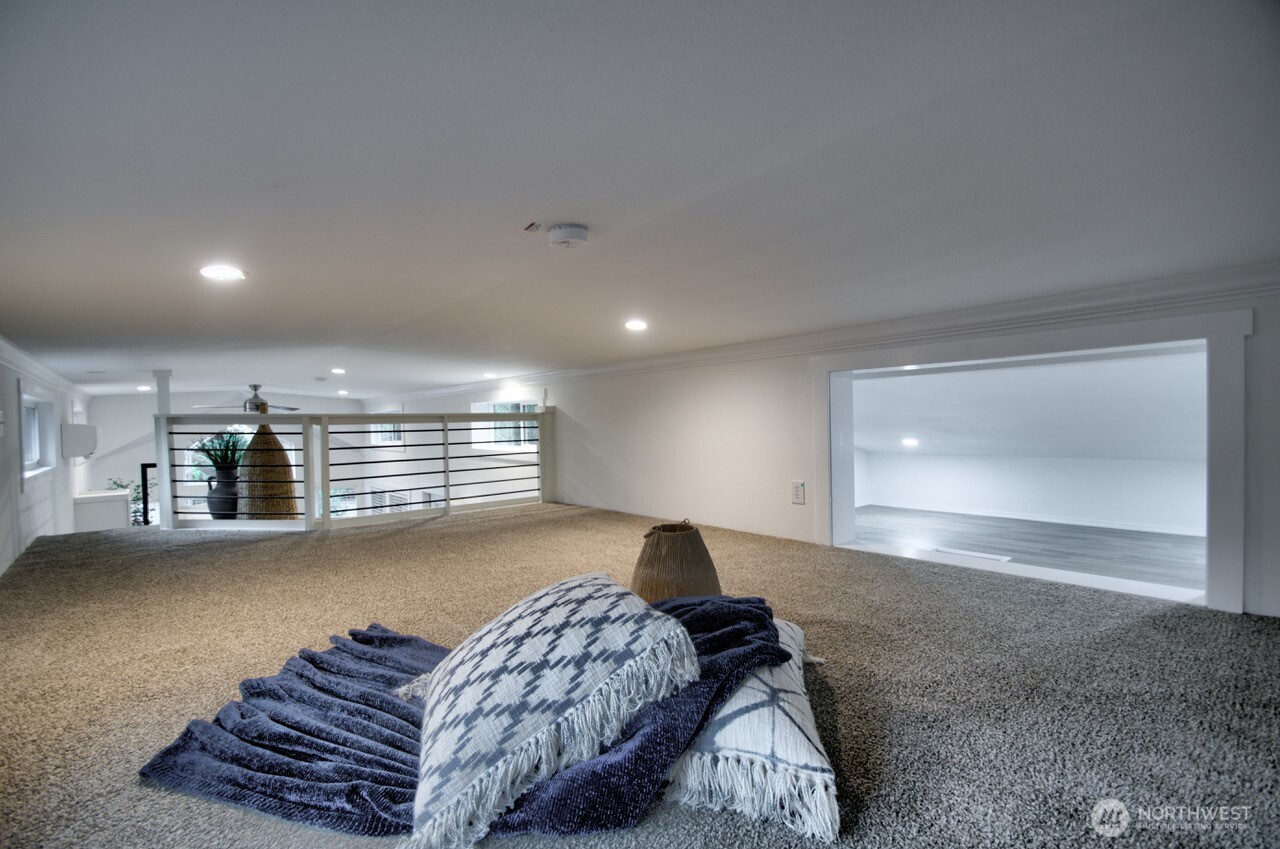 1546 Reservation Road Southeast, Unit 232 Olympia, WA 98513 - Photo 17 of 37 a living room with furniture and a ceiling fan