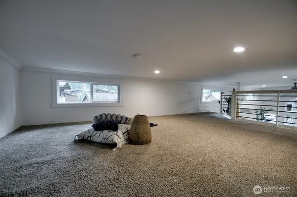 a view of an empty room and wooden floor