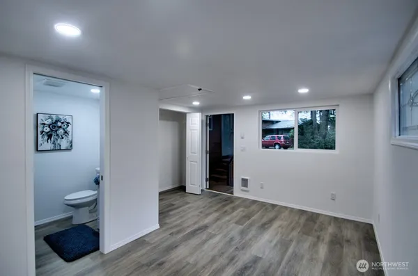a bathroom with a toilet sink and vanity