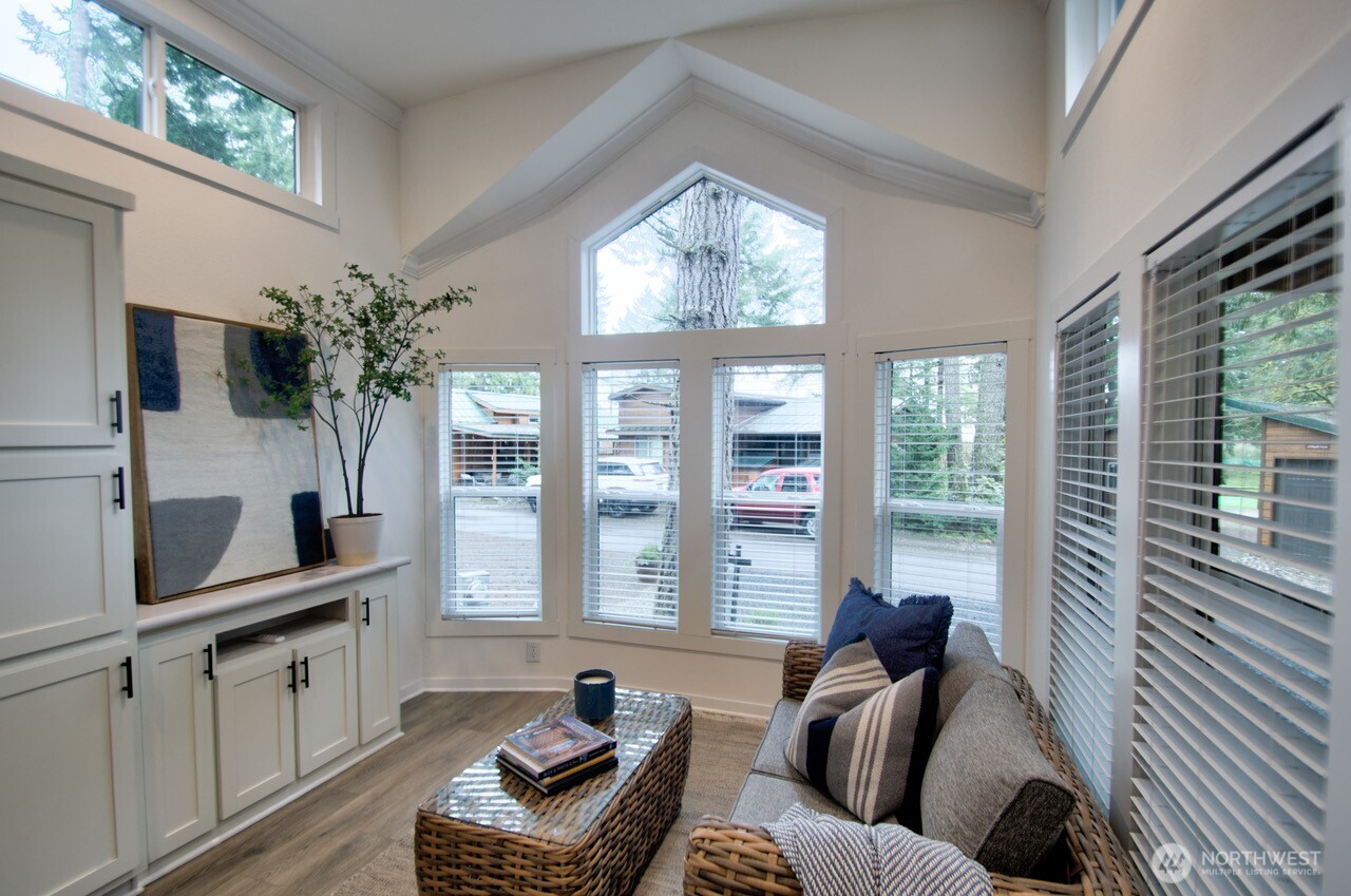 1546 Reservation Road Southeast, Unit 232 Olympia, WA 98513 - Photo 6 of 37 a living room with furniture and large windows
