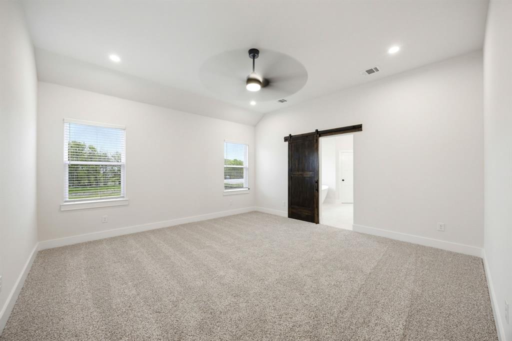 6709 Odom Road Sanger, TX 76266 - Photo 15 of 26 an empty room with windows and cabinet