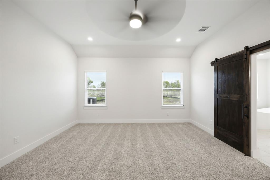 6709 Odom Road Sanger, TX 76266 - Photo 17 of 26 an empty room with windows and closet