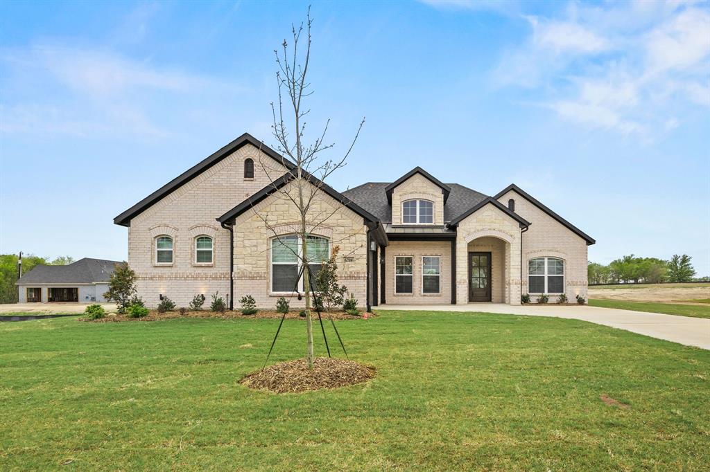 6709 Odom Road Sanger, TX 76266 - Photo 2 of 26 a front view of a house with a yard