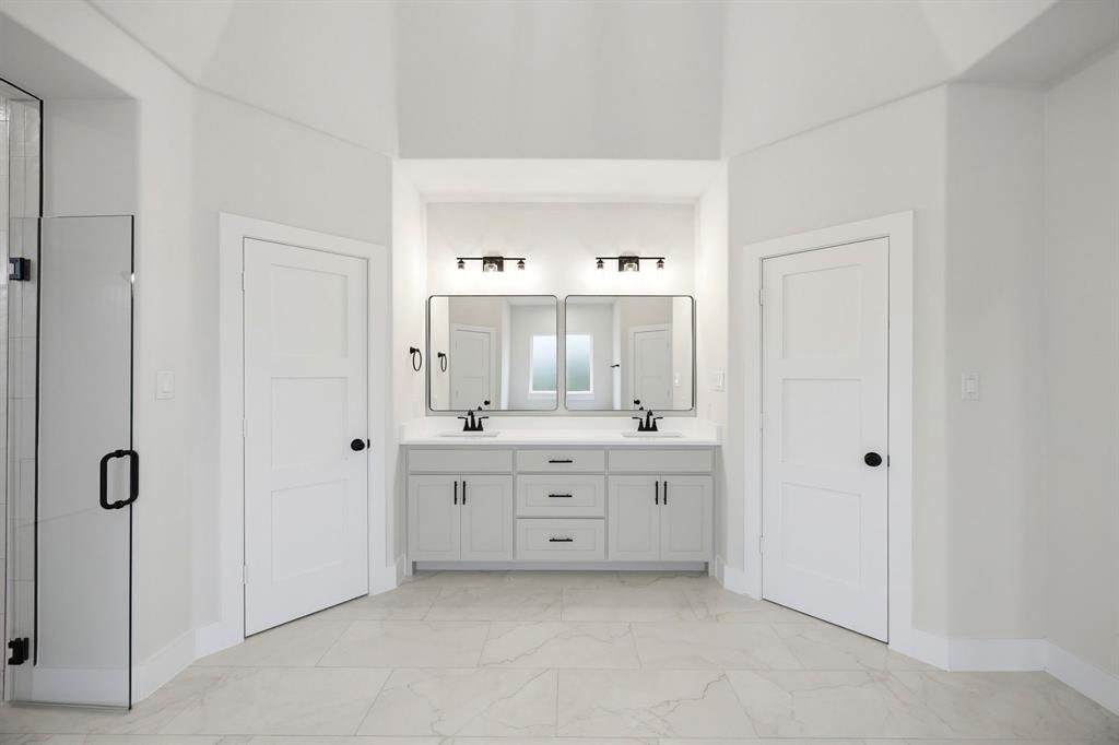 6709 Odom Road Sanger, TX 76266 - Photo 21 of 26 a bathroom with a granite countertop sink mirror and a bathtub
