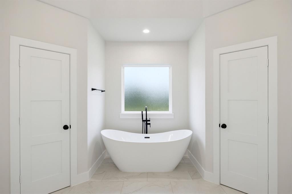 6709 Odom Road Sanger, TX 76266 - Photo 22 of 26 a bathroom with a sink and a mirror