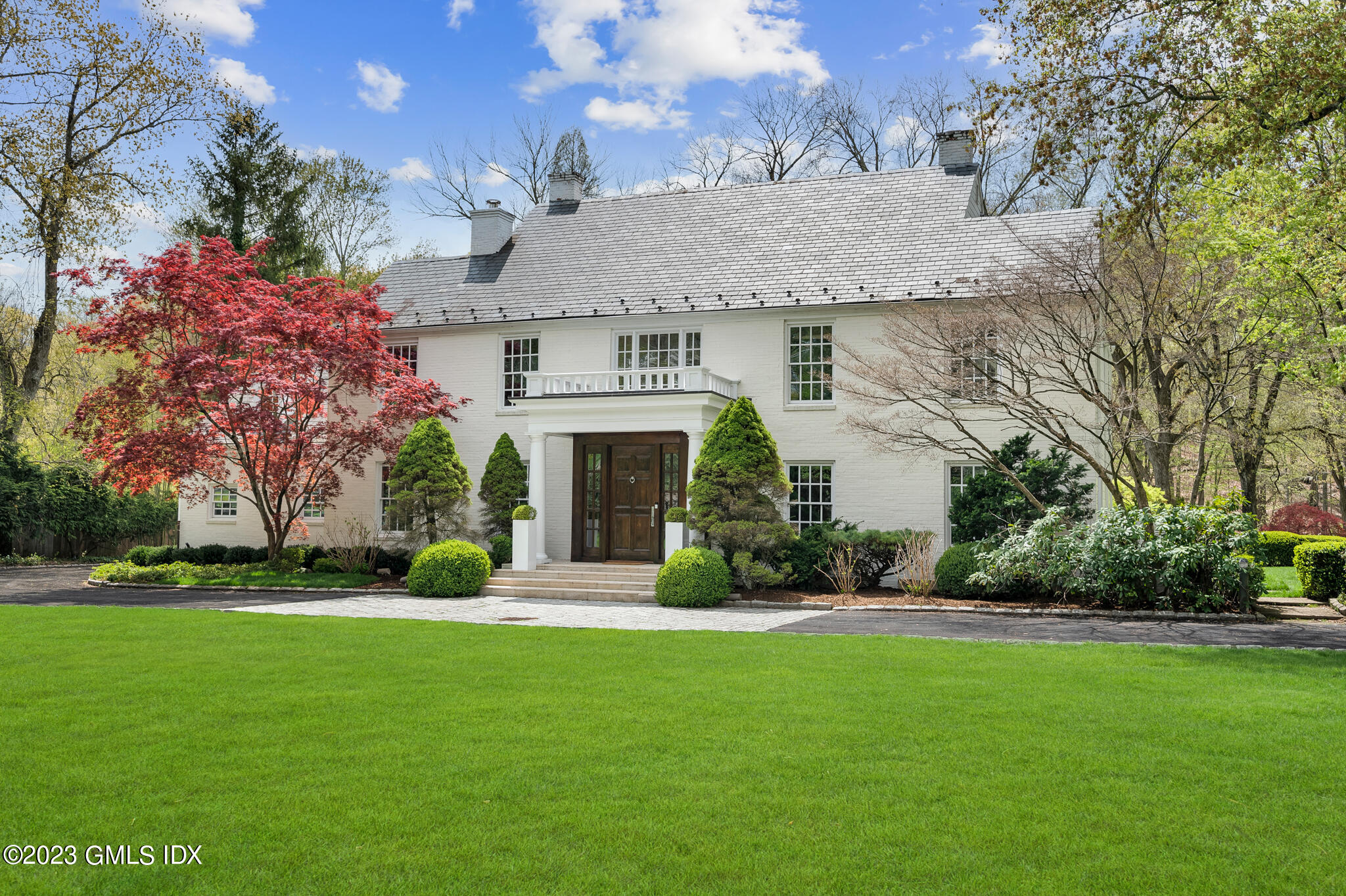 294 Riversville Road Greenwich, CT 06831 - Photo 17 of 17 a front view of house with yard and green space