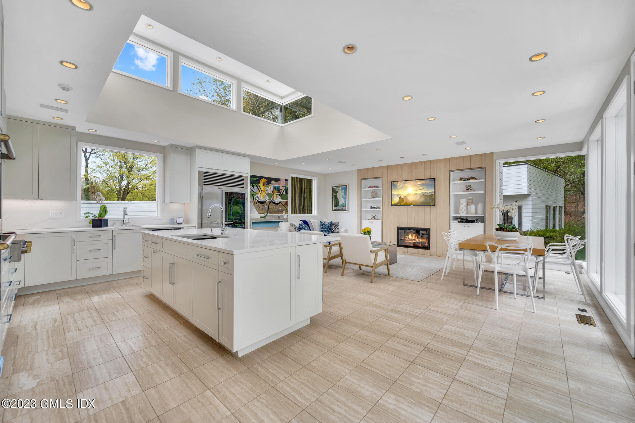 294 Riversville Road Greenwich, CT 06831 - Photo 3 of 17 a view of a living room kitchen and a wooden floor
