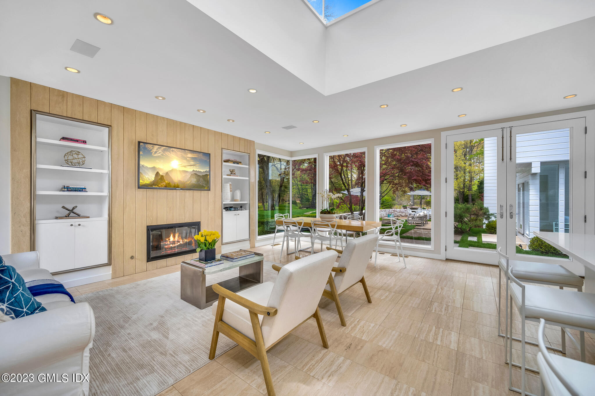 294 Riversville Road Greenwich, CT 06831 - Photo 4 of 17 a living room with fireplace furniture and a large window