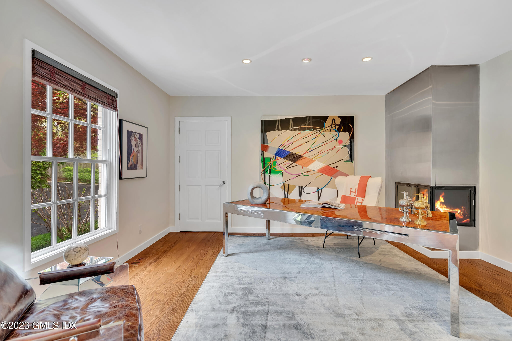 294 Riversville Road Greenwich, CT 06831 - Photo 8 of 17 a bedroom with furniture and a flat screen tv