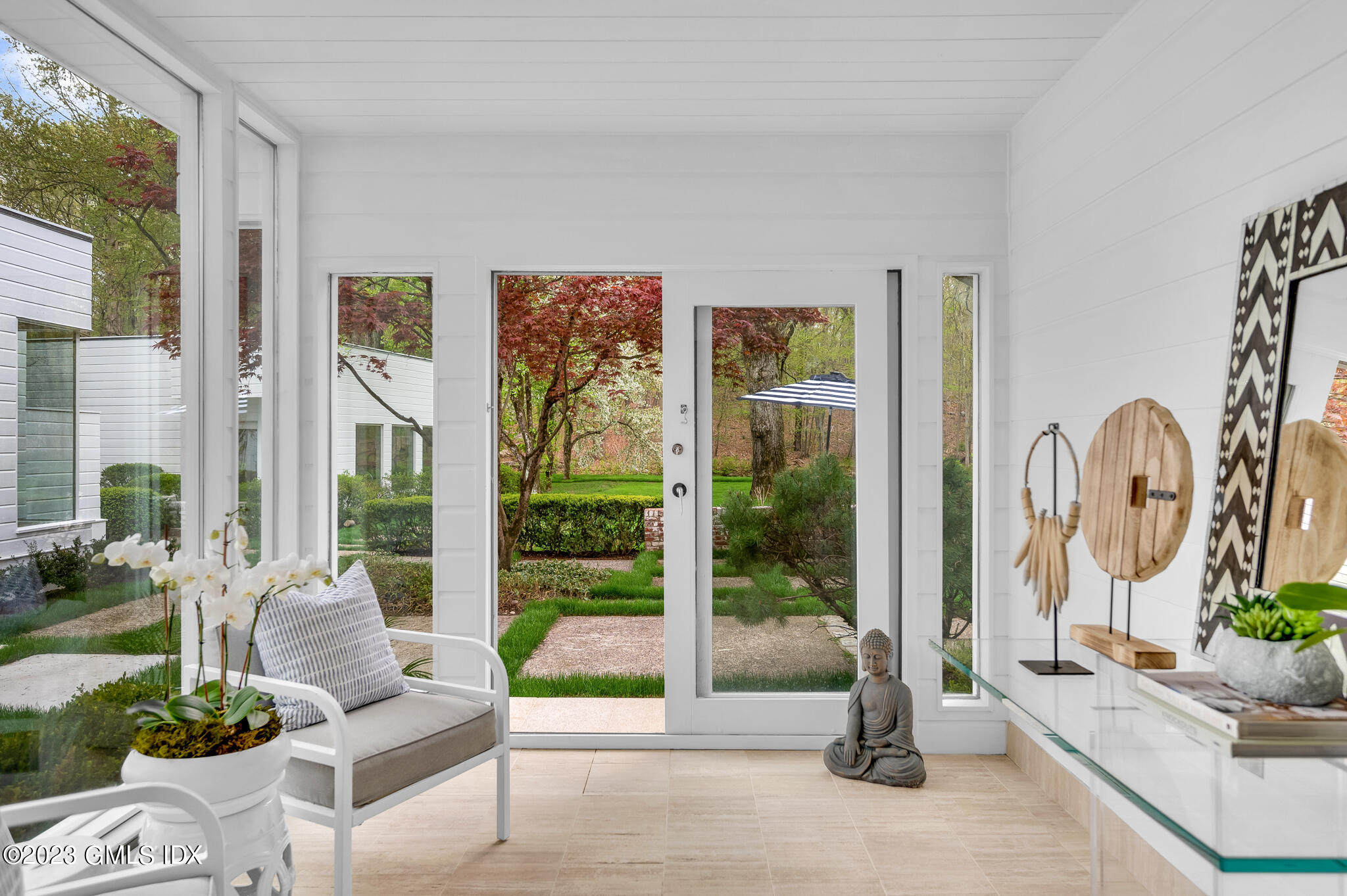 294 Riversville Road Greenwich, CT 06831 - Photo 9 of 17 a living room with furniture and floor to ceiling windows