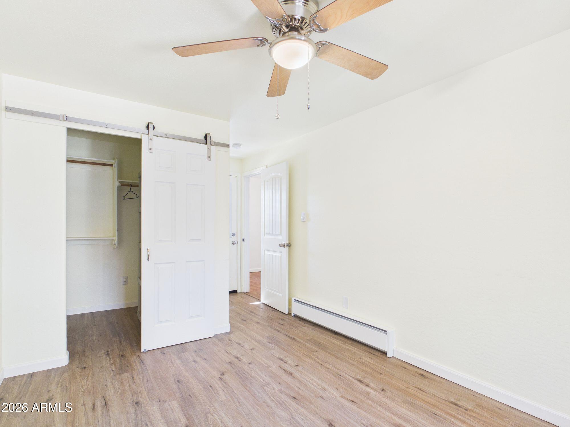 8071 Vista Del Norte Payson, AZ 85541 - Photo 12 of 27 a view of an empty room with wooden floor