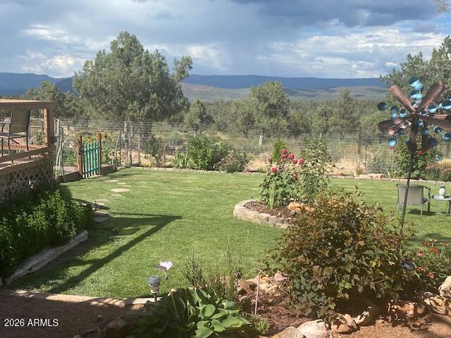 8071 Vista Del Norte Payson, AZ 85541 - Photo 13 of 18 a view of a garden with a building in the background