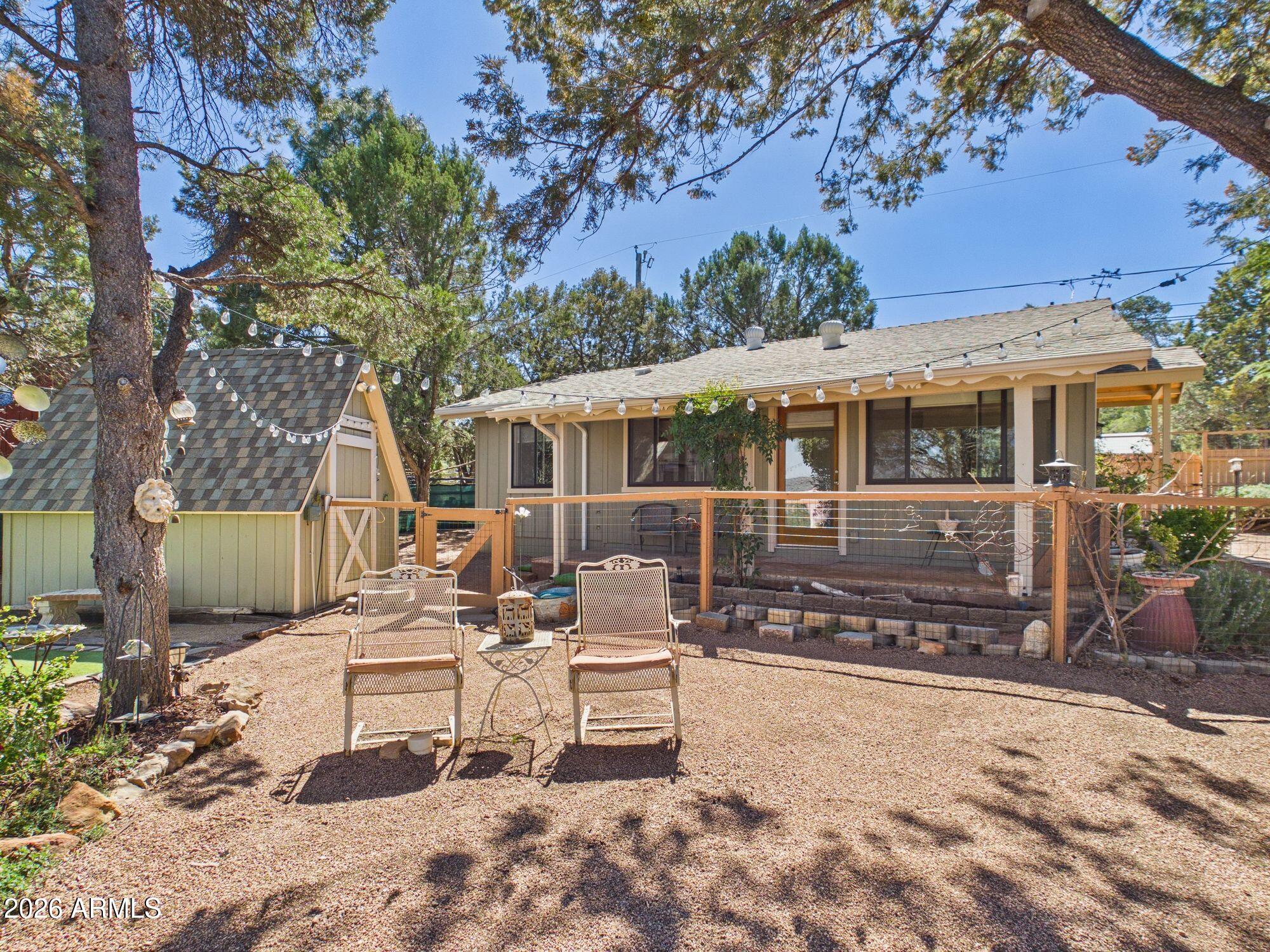 8071 Vista Del Norte Payson, AZ 85541 - Photo 14 of 27 a view of a patio with a table and chairs and potted plants