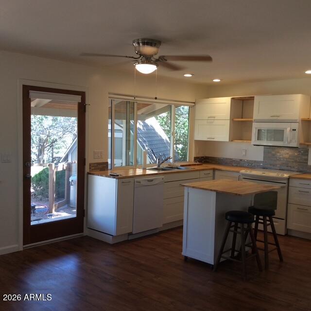 8071 Vista Del Norte Payson, AZ 85541 - Photo 4 of 18 a kitchen with stainless steel appliances granite countertop wooden floors and sink