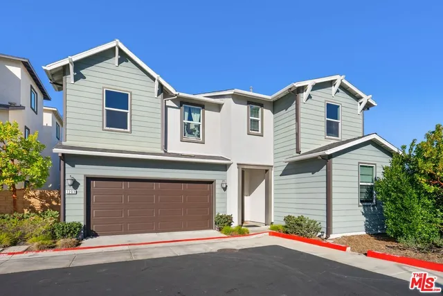 a front view of a house with a garage