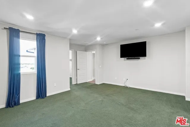 a view of a livingroom with a flat screen tv