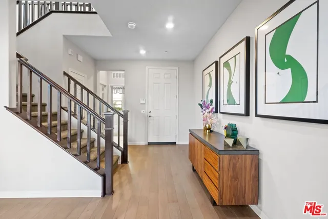 a view of an entryway with wooden floor