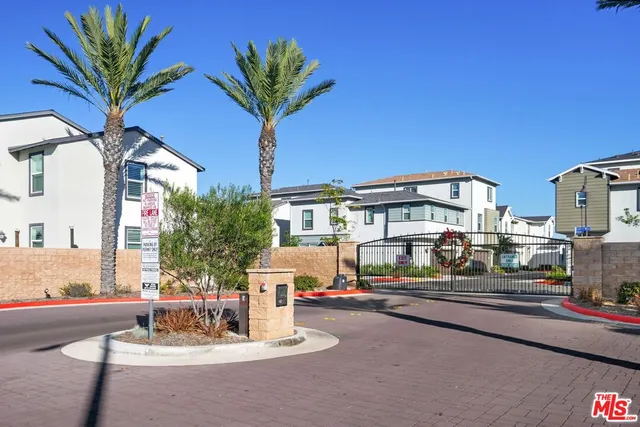a front view of a house with outdoor seating and city view