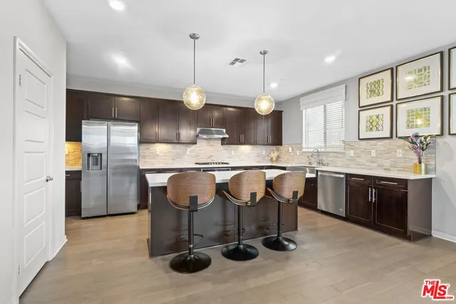 a kitchen with a sink cabinets and window