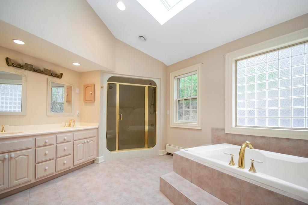115 Chilson Road Wilbraham, MA 01095 - Photo 19 of 35 a spacious bathroom with a tub sink and mirror