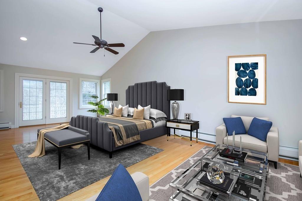 115 Chilson Road Wilbraham, MA 01095 - Photo 20 of 35 a spacious bedroom with a bed a couch and windows