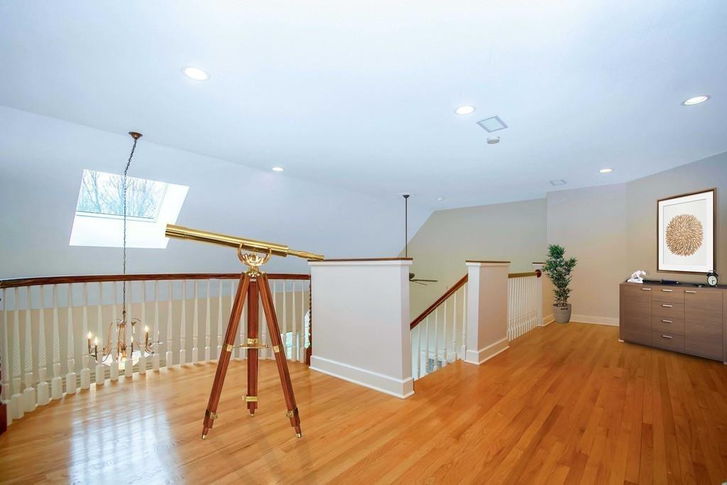 115 Chilson Road Wilbraham, MA 01095 - Photo 22 of 35 a bedroom with wooden floor and a ceiling fan
