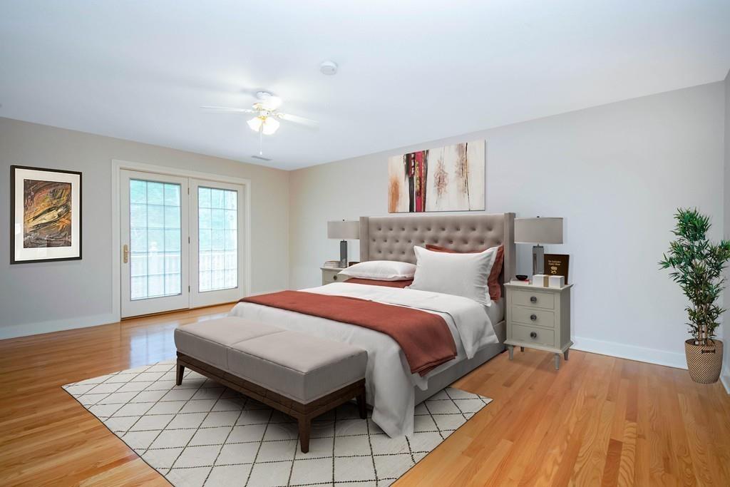 115 Chilson Road Wilbraham, MA 01095 - Photo 23 of 35 a bedroom with a large bed and a wooden floor