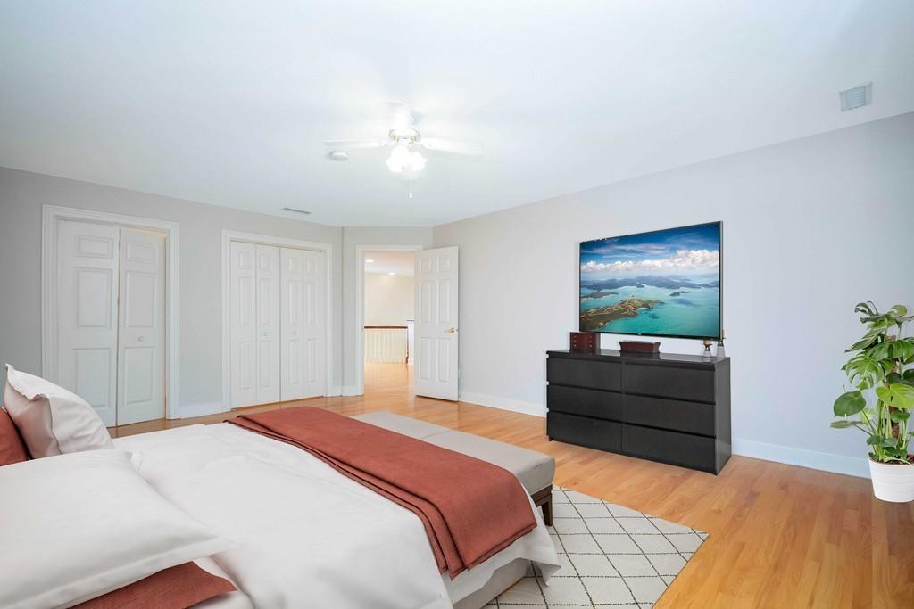 115 Chilson Road Wilbraham, MA 01095 - Photo 24 of 35 a bedroom with a bed and a chandelier