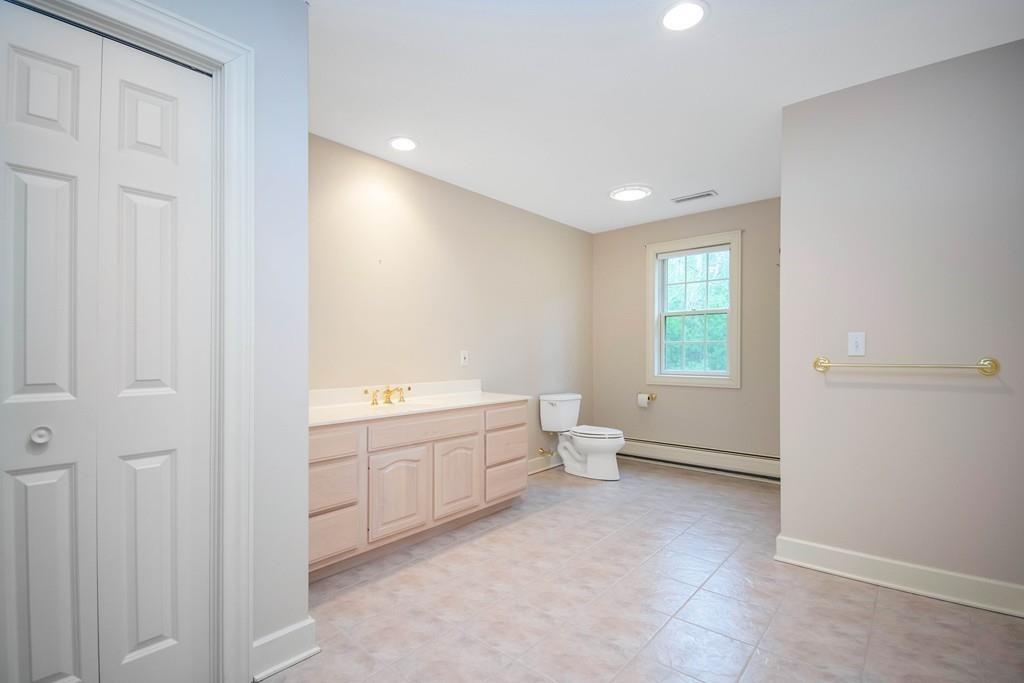115 Chilson Road Wilbraham, MA 01095 - Photo 25 of 35 a bathroom with a toilet sink and mirror