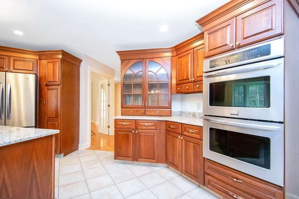 115 Chilson Road Wilbraham, MA 01095 - Photo 4 of 35 a kitchen with stainless steel appliances granite countertop a stove top oven and cabinets