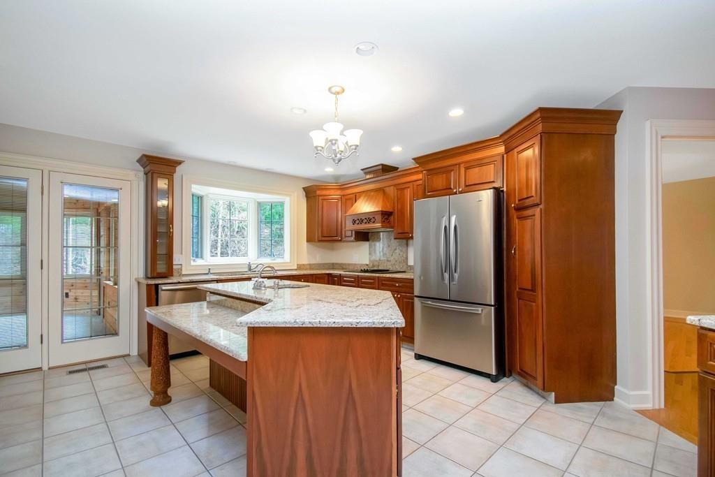 115 Chilson Road Wilbraham, MA 01095 - Photo 5 of 35 a dining hall with a stove a refrigerator and a sink