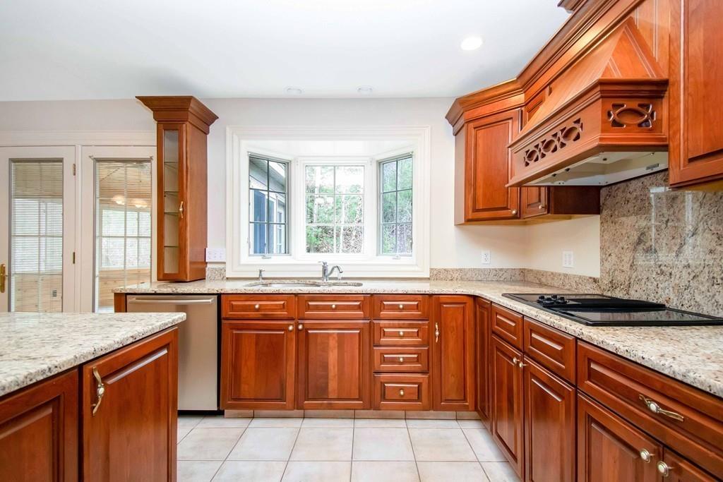 115 Chilson Road Wilbraham, MA 01095 - Photo 7 of 35 a kitchen with stainless steel appliances granite countertop a sink and a stove
