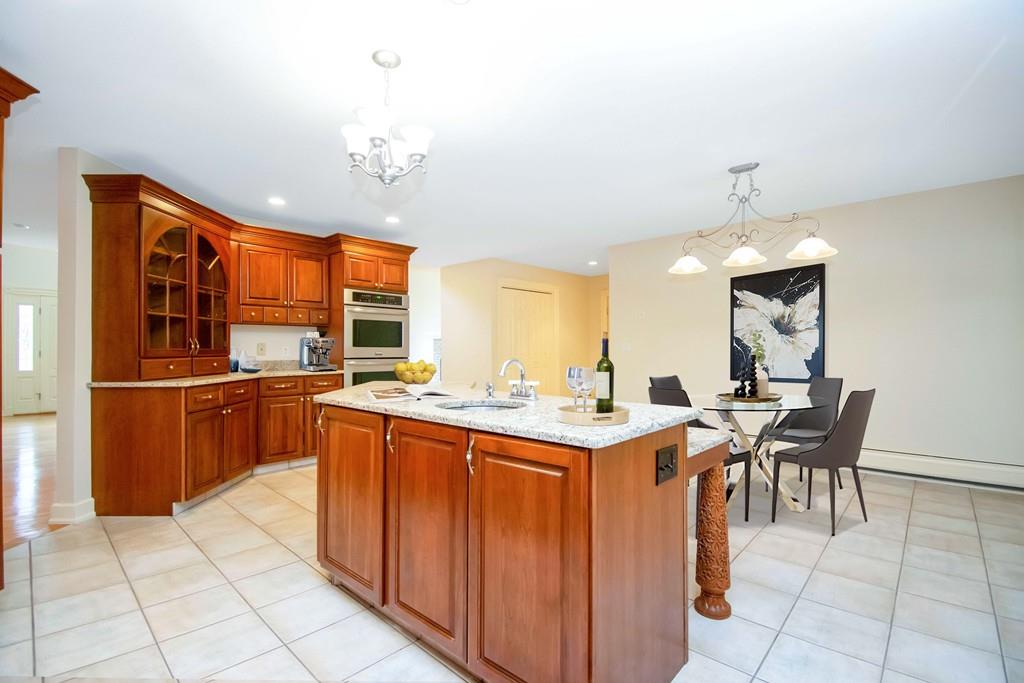 115 Chilson Road Wilbraham, MA 01095 - Photo 9 of 35 a kitchen with stainless steel appliances granite countertop a sink and a refrigerator