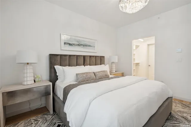 a bed room with a bed and a night stand