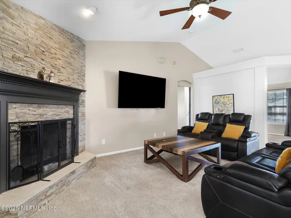 a outdoor living space with furniture and a fireplace