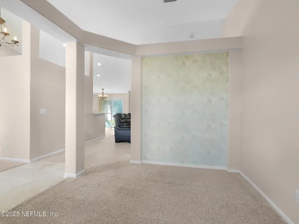 a view of a room with cabinet and a bathroom
