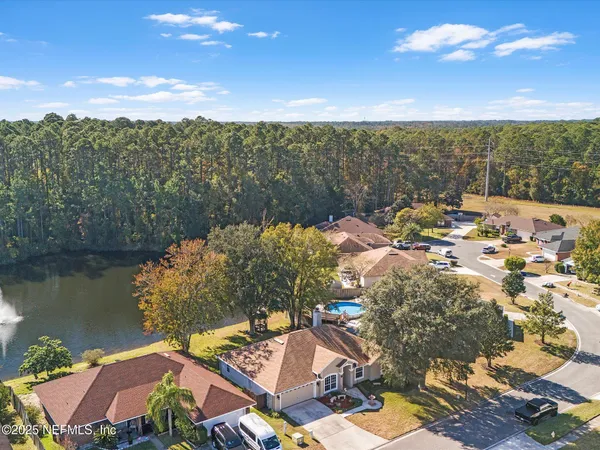 an aerial view of residential houses with outdoor space