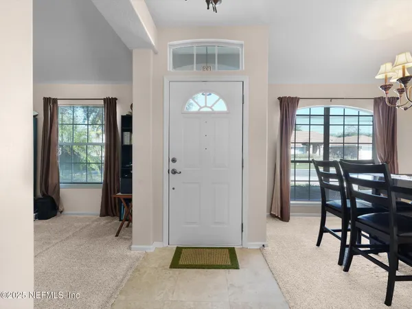 a view of a livingroom with furniture and window