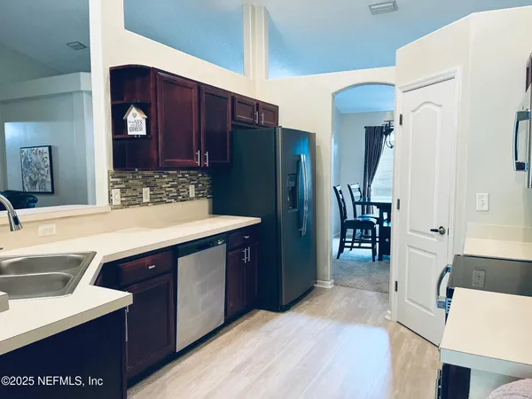 a spacious bathroom with a sink and a mirror