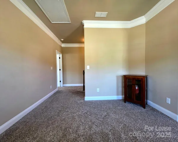 a bedroom with a bed and a ceiling fan