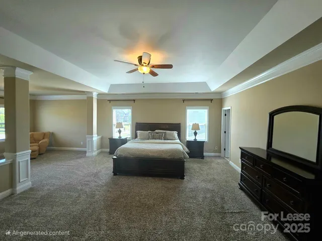 a bedroom with a bed and ceiling fan