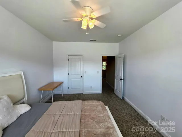 a view of a lake with houses in the background