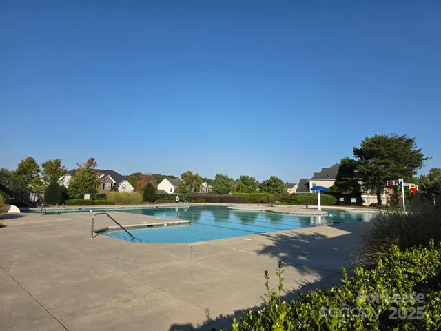 a view of a swimming pool with a patio