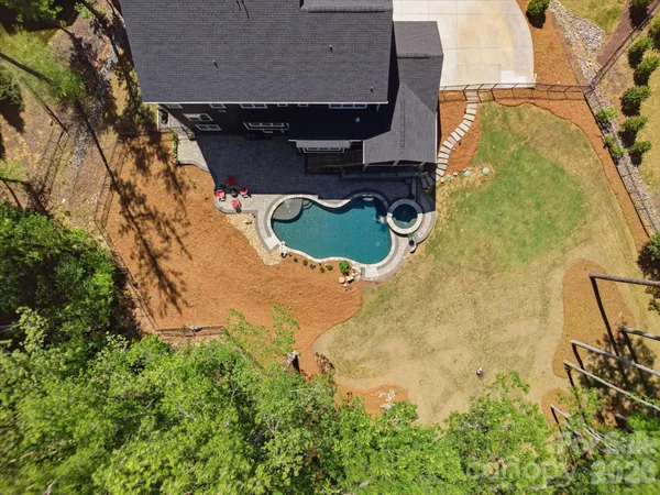 an aerial view of multiple houses with yard