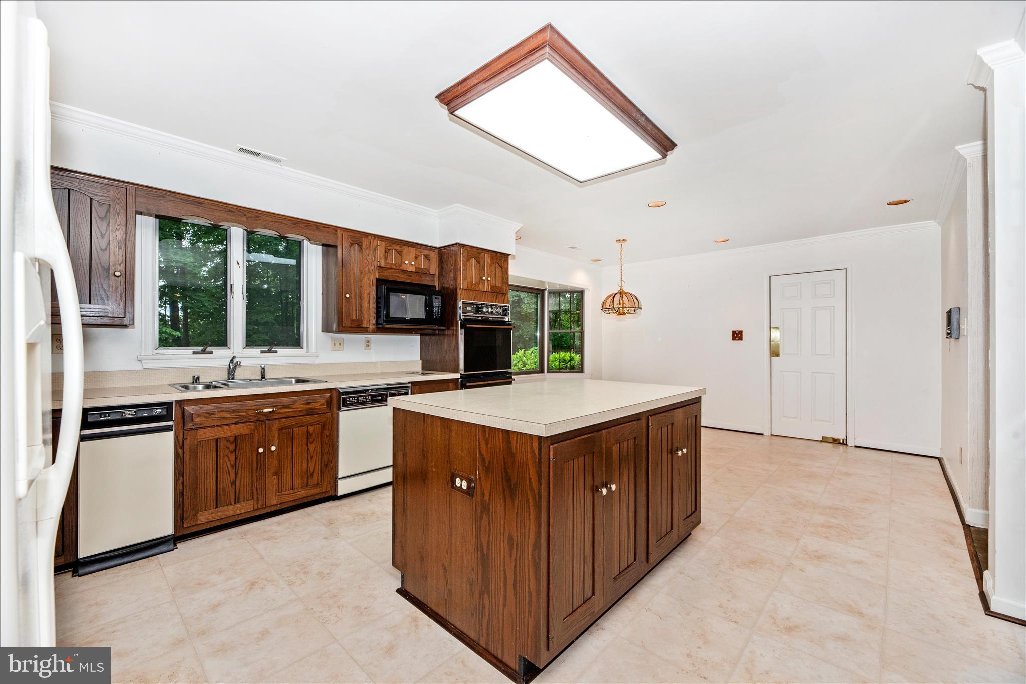 2221 Gold Mine Road Brookeville, MD 20833 - Photo 15 of 60 a kitchen with stainless steel appliances granite countertop a stove and a sink