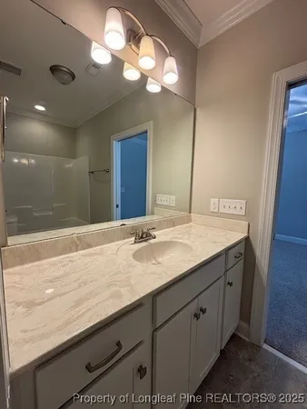 a bathroom with a sink a vanity and a mirror