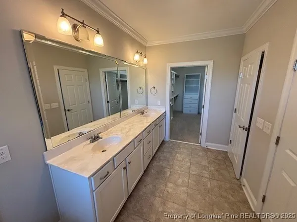 a bathroom with a sink and mirror