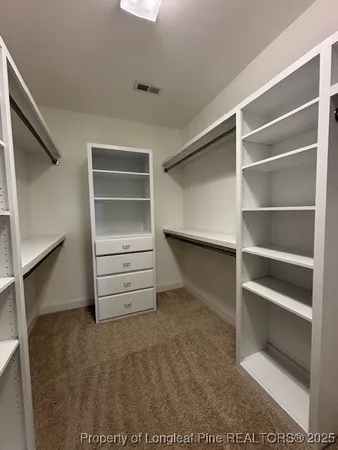 a view of an empty walk in closet